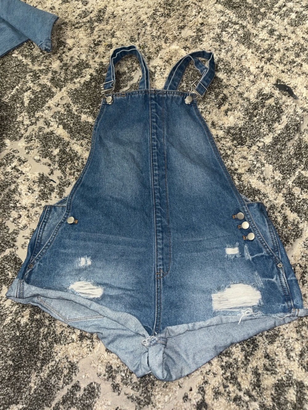 Distressed Denim Shortall Romper in Blue